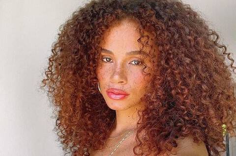 a woman with curly hair